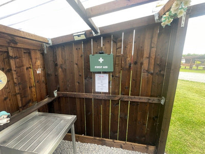 Wooden bench and planting at the site entrance